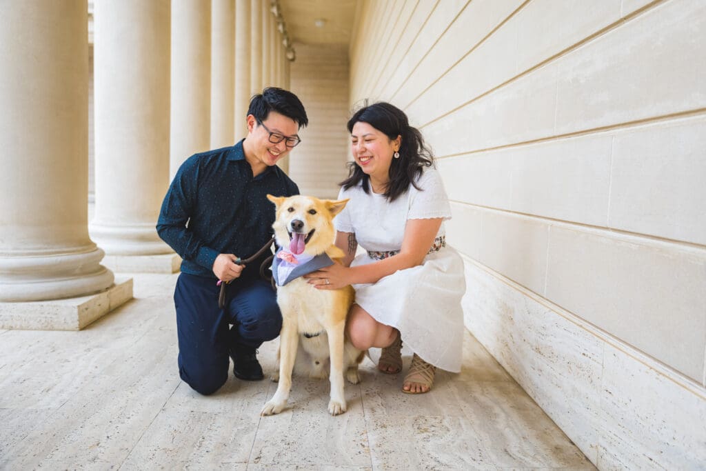 Couple with their dog enjoying a photoshoot, captured in a natural and candid moment by a San Francisco Bay Area wedding photographer.