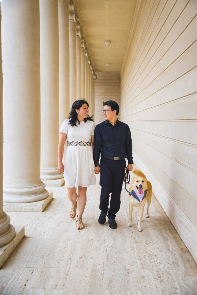Couple with their dog enjoying a photoshoot, captured in a natural and candid moment by a San Francisco Bay Area wedding photographer.