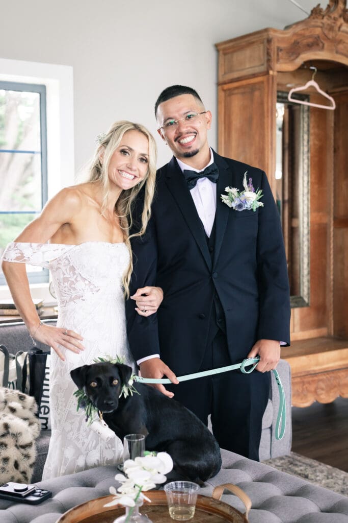 Couple with their dog at their wedding, captured in a natural and candid moment by a San Francisco Bay Area wedding photographer.