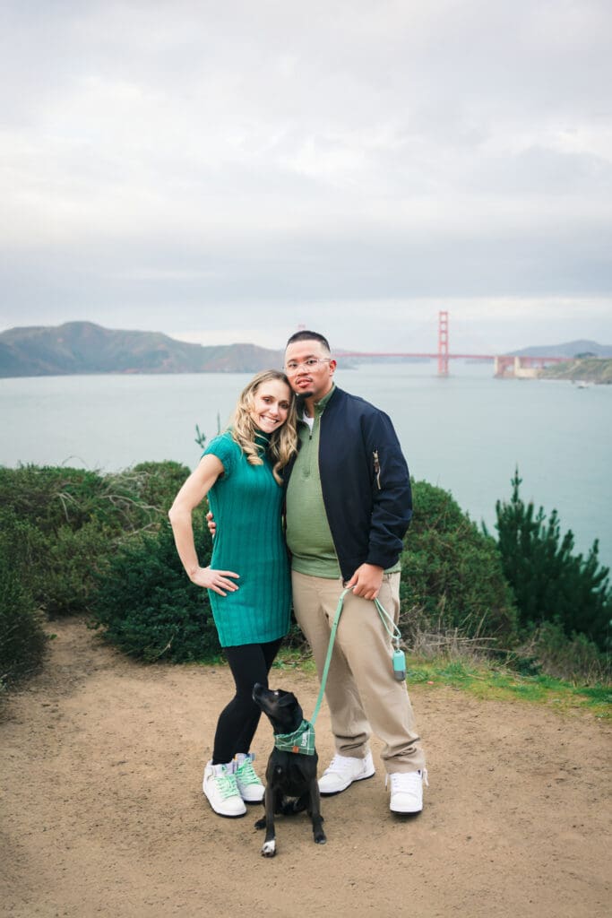 Couple with their dog enjoying a photoshoot, captured in a natural and candid moment by a San Francisco Bay Area wedding photographer.