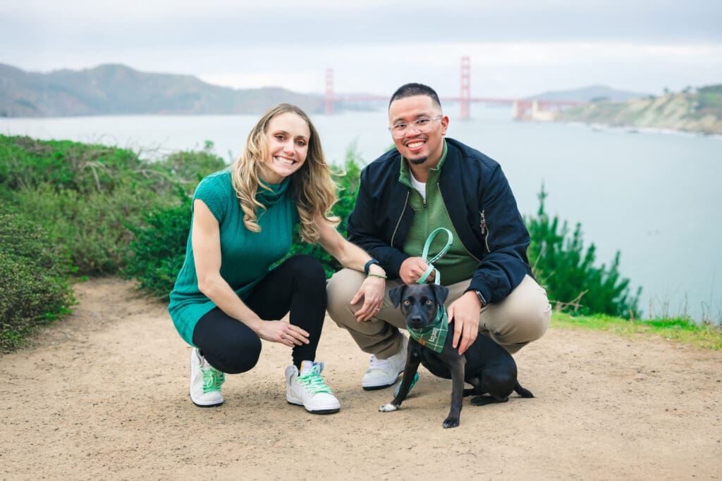 Couple with their dog enjoying a photoshoot, captured in a natural and candid moment by a San Francisco Bay Area wedding photographer.